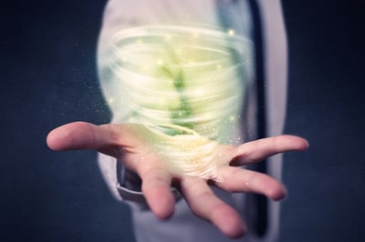 Bright green tornado in the hands of a businessman