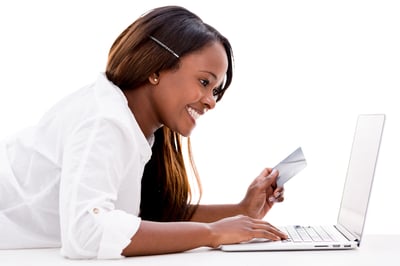 Woman paying online with a credit card - isolated over white